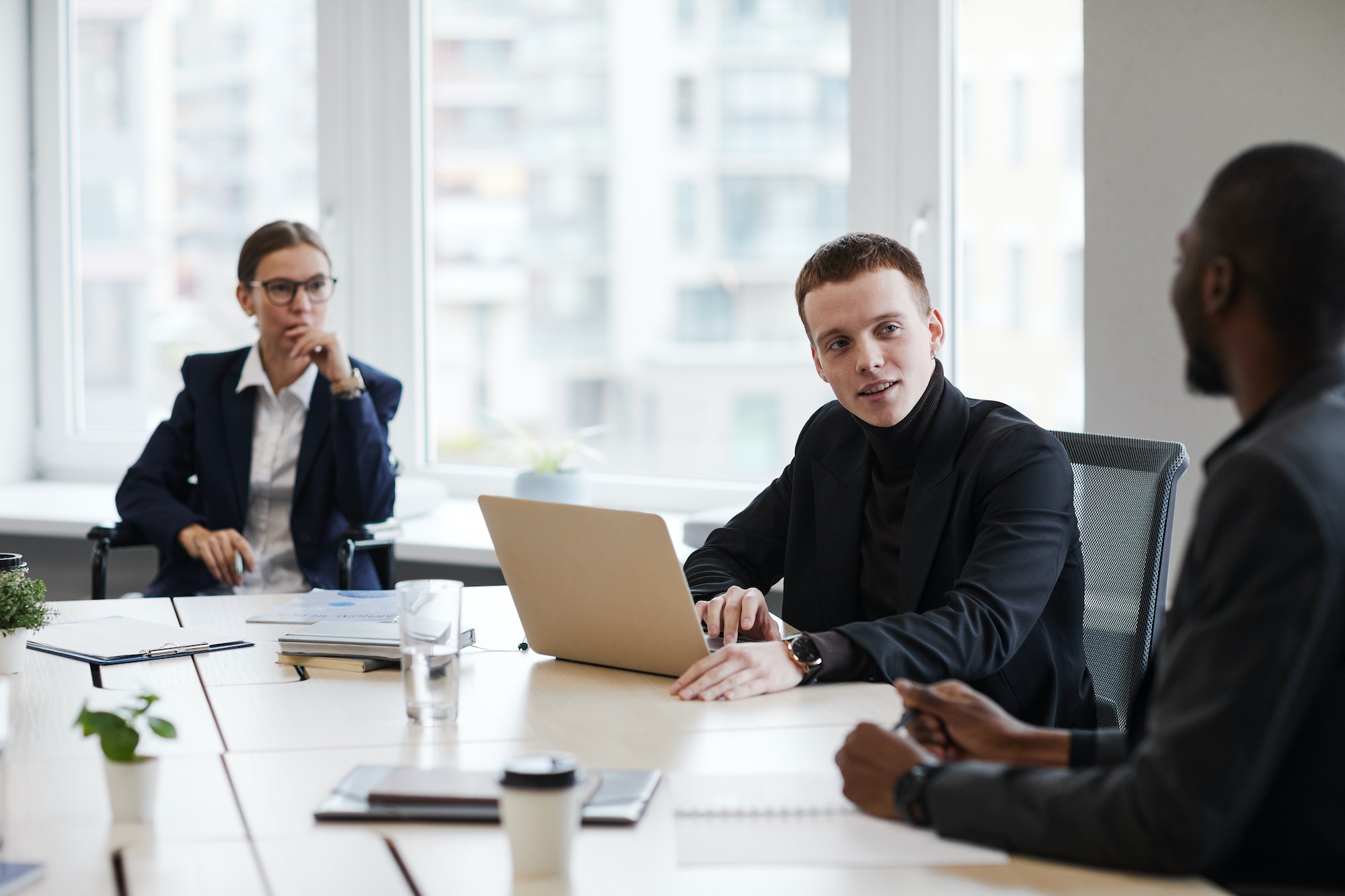Young Businessman Speaking in Meeting